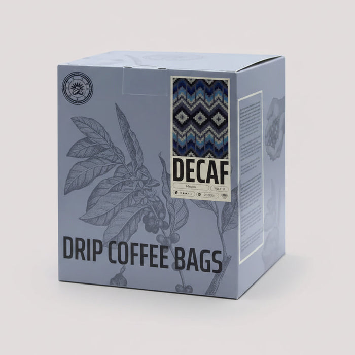 Box of decaf drip coffee bags with coffee bean illustration on a light gray background