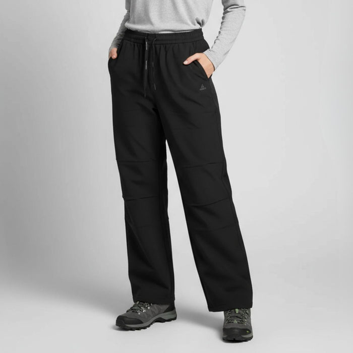 Humtto softshell bikses melnas, plašas, ūdensizturīgas, piemērotas pārgājieniem un āra aktivitātēm Latvijas laikapstākļos.