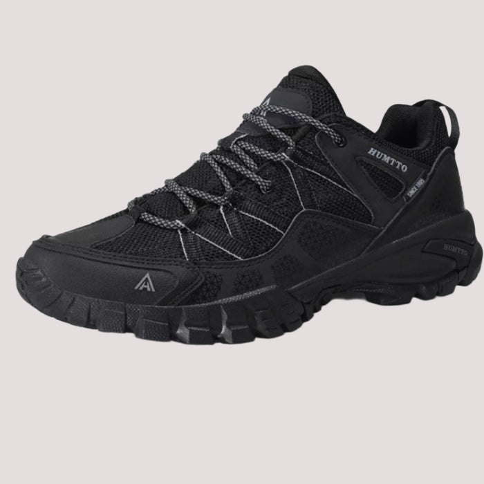 HUMTTO TrailGrip Low – sieviešu vieglas melnas pārgājienu kurpes ar EVA amortizāciju, arch atbalstu un pirkstu aizsardzību.