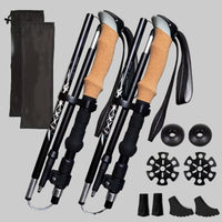 Set of four black hiking poles with cork grips, accessories, and carrying bag 2pcs